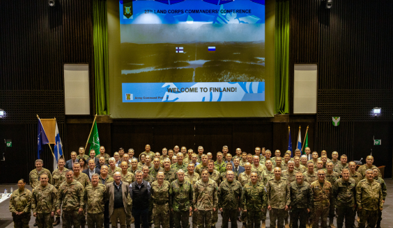 Commanders in a group photo in the auditorium.
