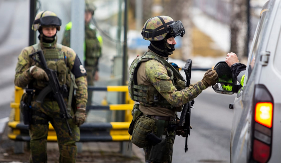 Two soldiers next to a van