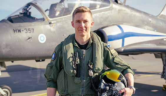 Captain Ville Luukkonen next to a Hawk jet trainer.