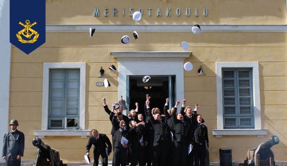 Naval Cadets throwing their caps in the air. Photo: Hans Laine.