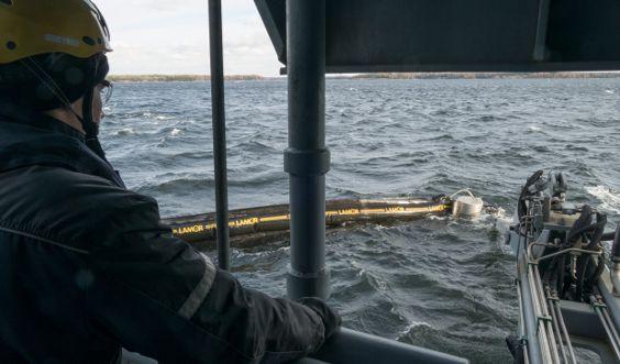 Oil recovery vessel in action at sea.